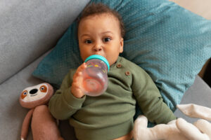 toddler drinking in sippy cup